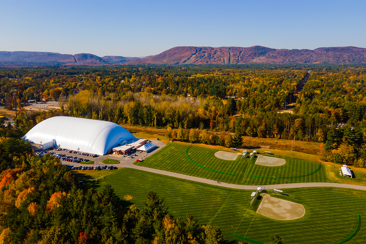 Afrim’s ADK Dome, Queensbury NY When you're planning your next sporting event, look no further than the Lake George Area where you can maximize your playtime both on and off the field. We're not just a destination for sports – we're your ultimate sporting vacation! Centrally situated in the northeast, the Lake George Area is within a 4 hour drive of major metropolitan cities like New York, Boston, Montreal, and Philadelphia. With close proximity to the highway and less than 45 minutes from Albany International Airport, reaching this sporting paradise is both convenient and scenic, ensuring a seamless journey for all involved. World-Class Sports Facilities The Lake George Area is a fantastic destination for year-round sports enthusiasts, thanks to its natural landscape and extensive outdoor venues. With a pristine 32-mile lake, over 200 miles of trails, and two groomed mountains, it's an ideal setting for activities such as trail running, hiking, mountain biking, and skiing. In addition to these natural wonders, the region offers a range of multi-sport facilities. Enjoy the crisp autumn air on baseball and softball fields, or take advantage of the large outdoor fields with turf and grass for soccer, lacrosse, ultimate frisbee, golf, and disc golf. The Lake George Area also features top-notch indoor sports venues, including arenas, sports domes, bowling alleys, and courts. These facilities are well-suited for indoor volleyball, basketball, bowling, indoor rock climbing, hockey, and more, making it an excellent destination for athletes year-round. The region has a strong tradition of hosting various tournaments and professional sports, such as the Lake George Triathlon, ECHL’s Adirondack Thunder, Adirondack Youth Hockey, WPBA Bowling Championship, and several NYS Public High School Athletic Association championships in basketball, volleyball, cross country, and nordic and downhill skiing. Ample Lodging Options From waterfront hotels to nationally recognized brand name resorts, you can find the perfect acco